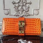 HERM Medor Clutch Bag In Orange Crocodile