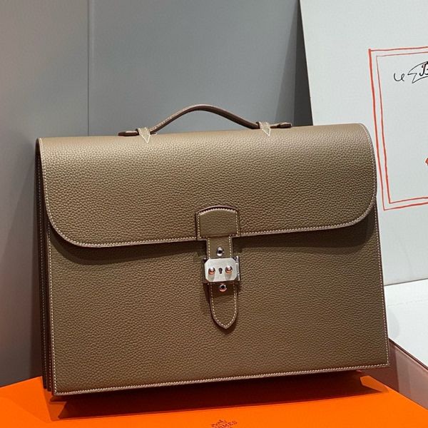 hsad38clta_1800x1800_c43c38bb-7cde-47f0-a42c-57fe9d4bcd8a.jpg HERM Sac a Depeches 38 Briefcase in Taupe - Image 1
