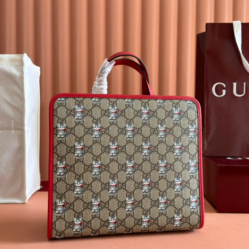 img_89648692_20241218_i1734509199_645_2_jpg_1800x1800_2c93f2ce-62ff-474d-846b-c6d4495bf84a.jpg CHILDREN'S PRINTED CAT TOTE BAG 28.5 IN BEIGE AND DARK BROWN GG CANVAS RED TRIM - Image 1